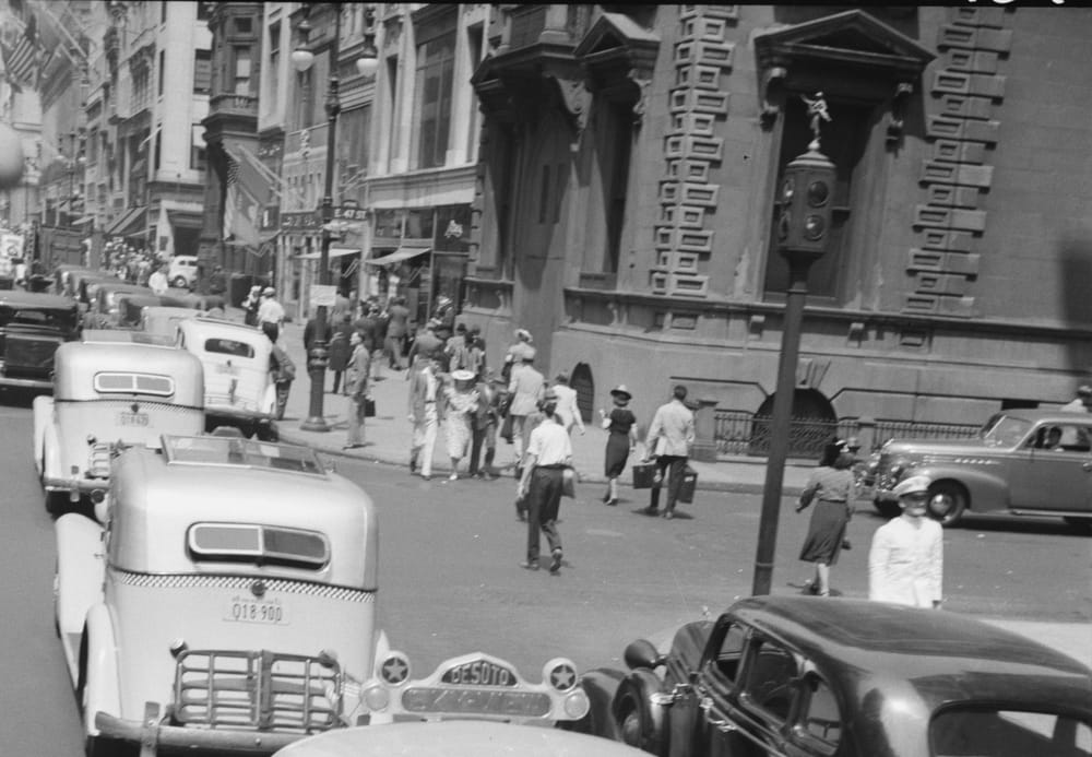 Cars and people on Fifth Avenue