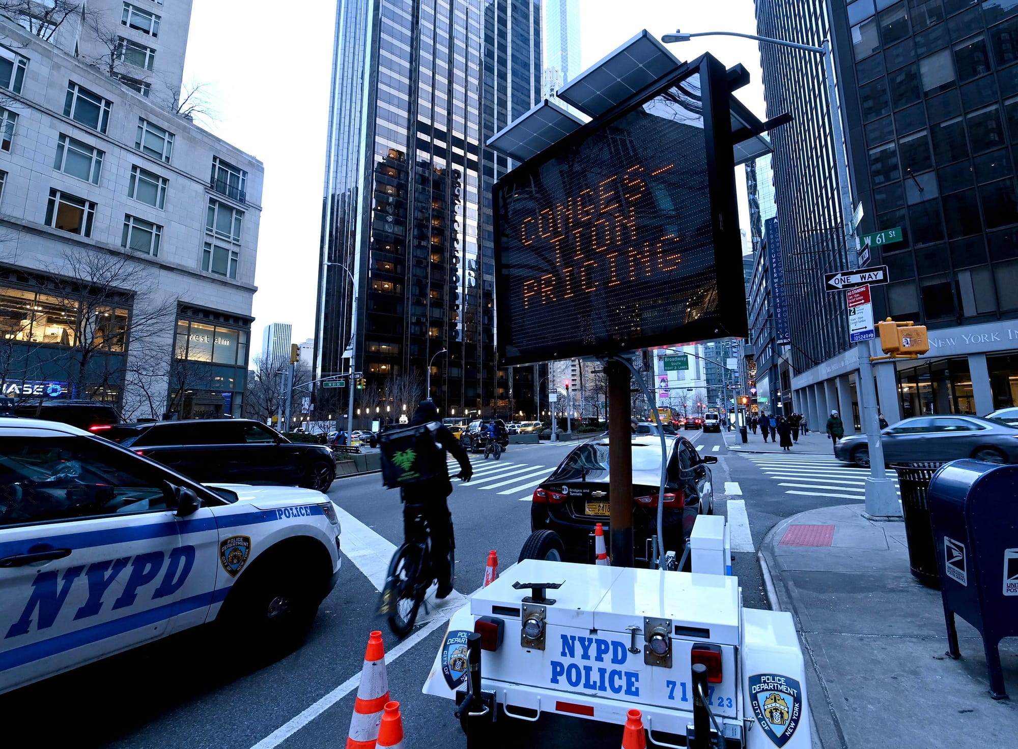 An NYPD Police digital sign reads "Congestion Pricing"