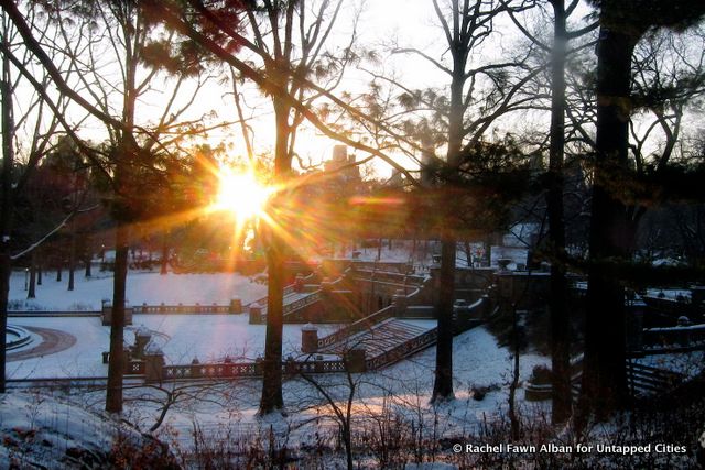 Sunrise over snowy Bethesda Terrace. 