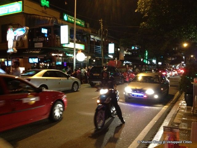 A Cop Pauses Amidst Traffic