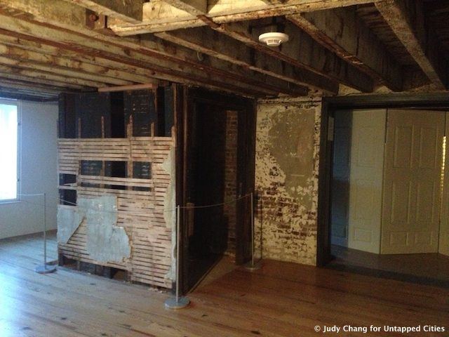 Visitors can walk through the laundry room and the guest room hallways that were once part of a hotel at the site