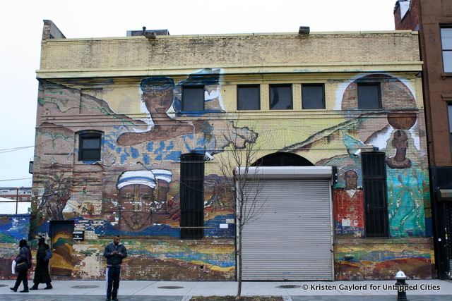 "Mural art by Nafissa Samara" at Fulton Street and Tompkins Avenue.