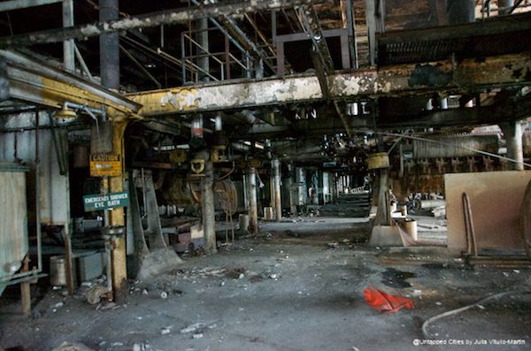 Eye bath stations throughout the refinery building stand as bleak reminders of dangerous work.