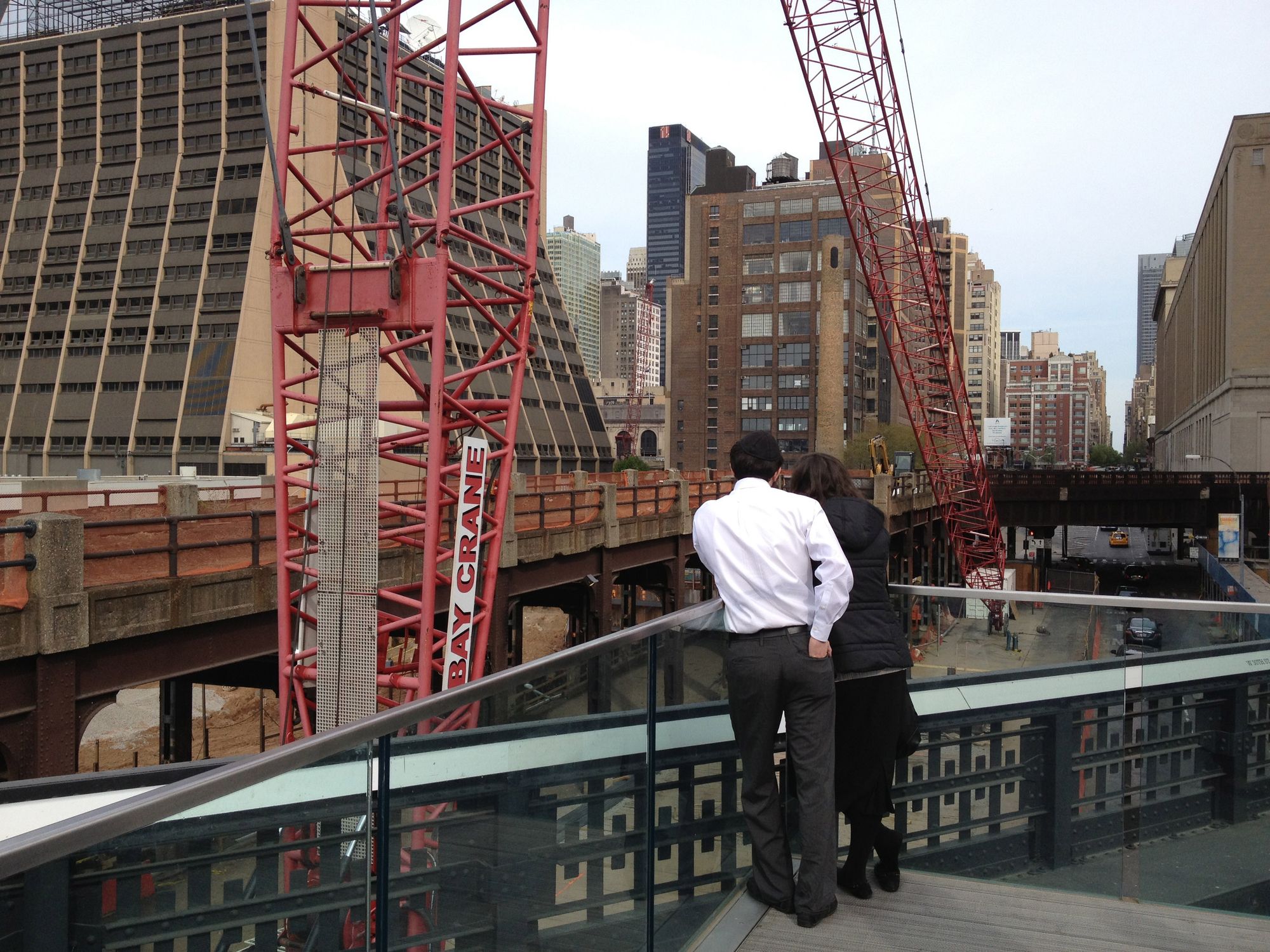 Construction cranes dominate the view from the end of the High Line