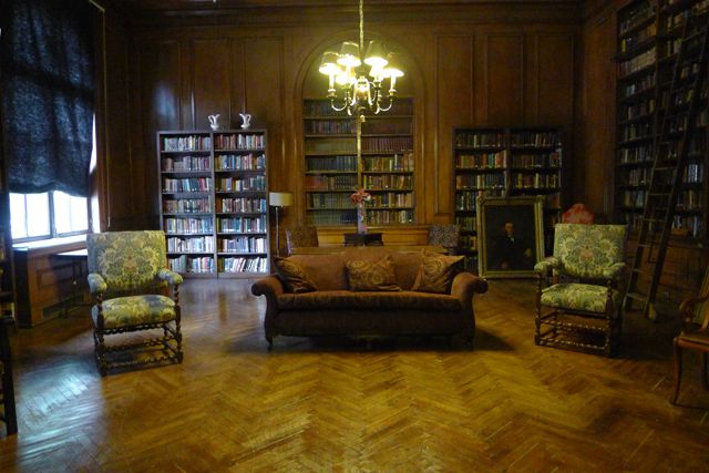 The library still has the original furniture, including the ladder from the 1920s