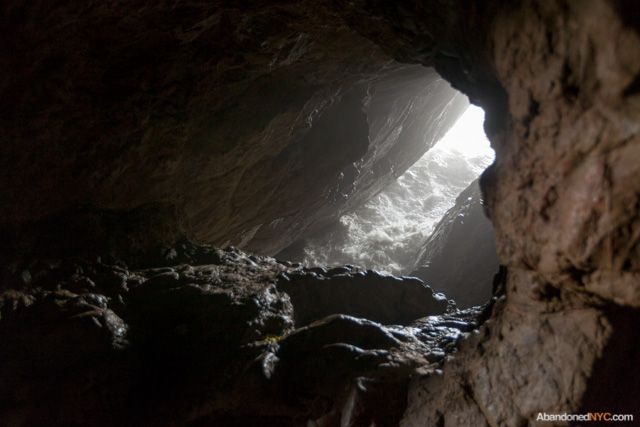 A misty opening reveals the teeming ocean below.