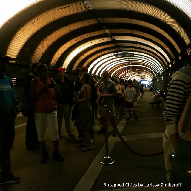 Guests wait in line to speak into a microphone that controls the lights.