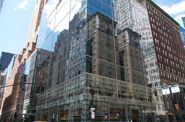 Madison Ave stone-brick bldgs in glass