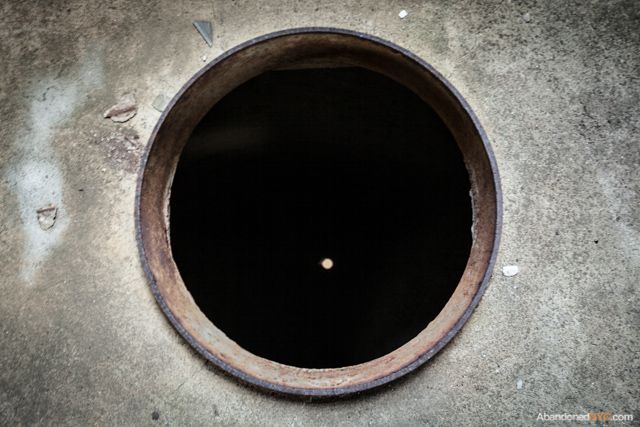 The top floor is strewn with manhole-sized apertures, which give way to the mind-numbing vacuum of the empty grain silos.