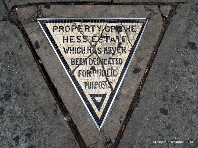 Hess triangle plaque in the sidewalk