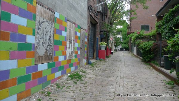 The colorful mural that was on the east wall in 2010 is now gone, replaced by stucco