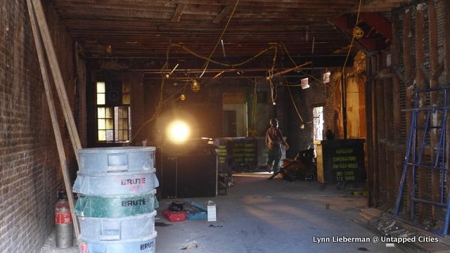 The back wall and back door of the old Lenox Lounge space