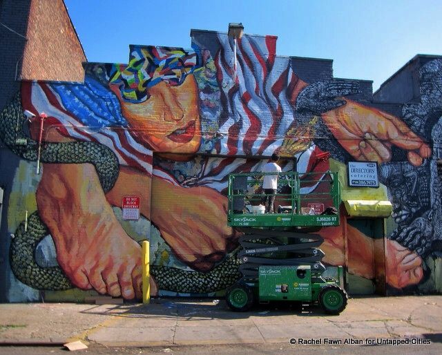 Ever Siempre at work on his collaborative mural with Zio Ziegler 