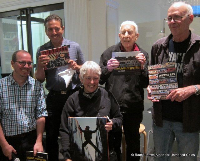 The photographers who documented New York’s graffiti art movement in 1970s and ’80s posing with their work, remind us of their muses, the Graffiti Kids.  Pictured: curator Sean Corcoran, Jay Edlin, Martha Cooper, Jon Naar, and Henry Chalfant.