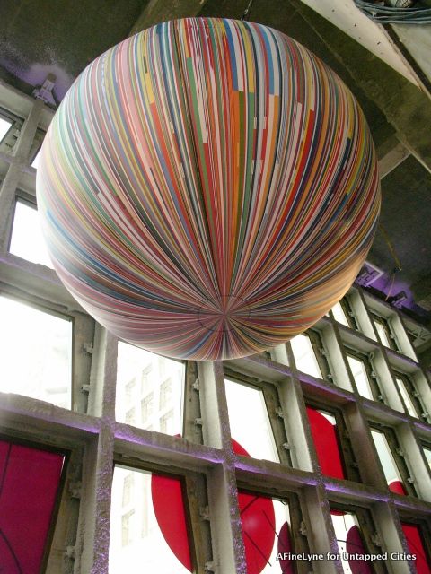 Beninese artist Meschac Gaba's 'Citoyen du Monde' hangs in the middle of The Africa Center's atrium