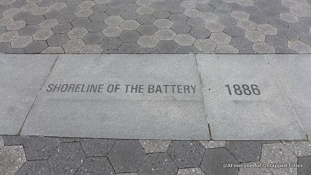 Marker set in stone indicating the changing shoreline