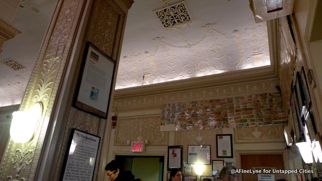 A collection of foreign currency left on tables over the years, saved and on view near the entrance