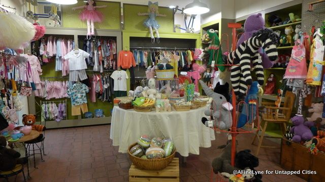 Filled with handmade children's clothes - this section of the shop getting ready for Easter