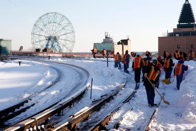 MTA employees clears snow from the Q train track in the Coney Island neighborhood of the Brooklyn borough of New York, Tuesday, Dec. 28, 2010. (AP Photo/Mary Altaffer)