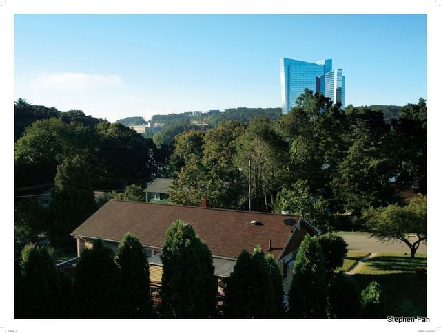 The Mohegan Sun casino rises behind a suburban ranch house in Montville, Connecticut