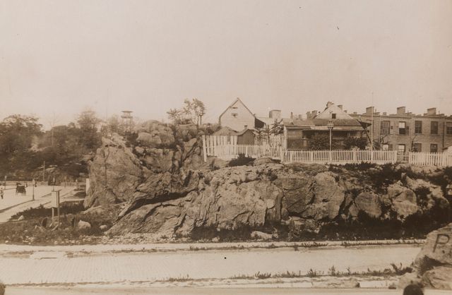 The watch tower in Mount Morris Park is visible in the background.