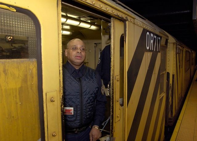 A man stands inside the armored Money Train