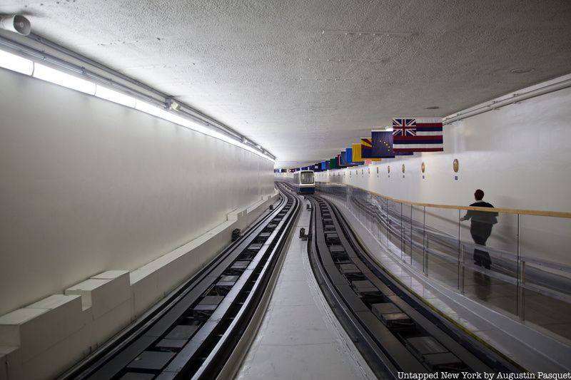 Man walking in tunnels next to subway tracks under capitol hill