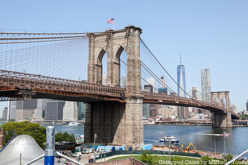 The Brooklyn Bridge with a background of the lower Manhattan skyline.