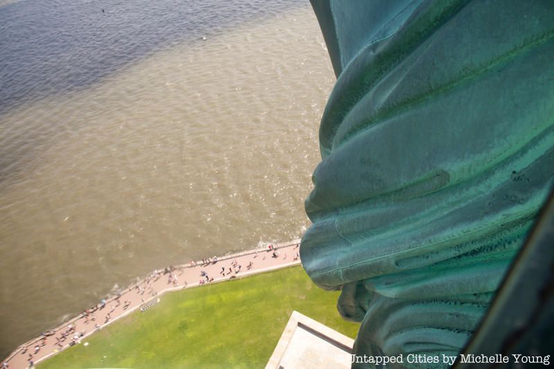 Statue of Liberty crown view of the side of the statue and the water below