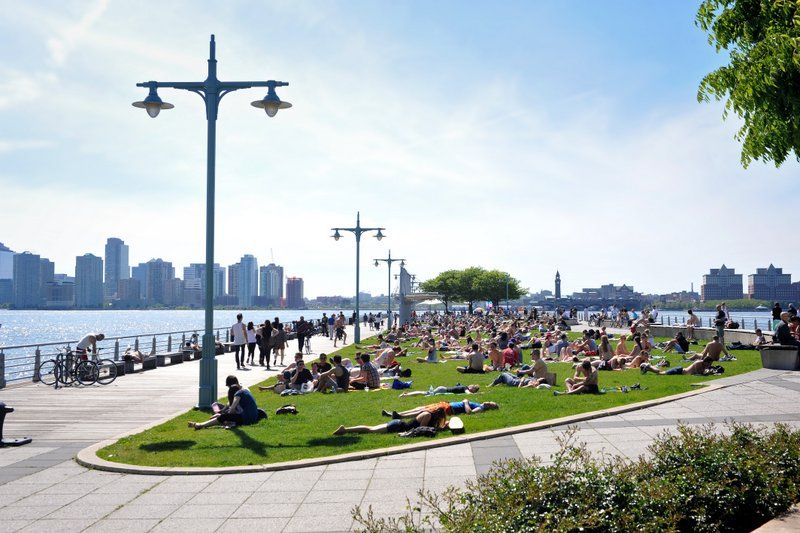 People sunbathing at Hudson River Park