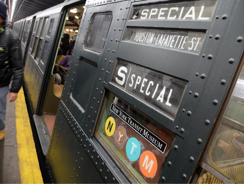 Vintage subway signange on the side of a Holiday Nostalgia Ride car