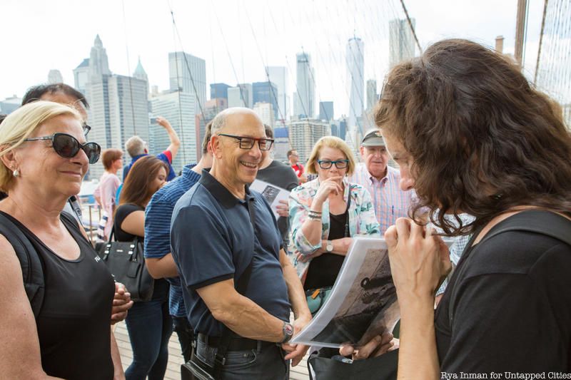 Tour group on a spring walking tour of the Brooklyn Bridge