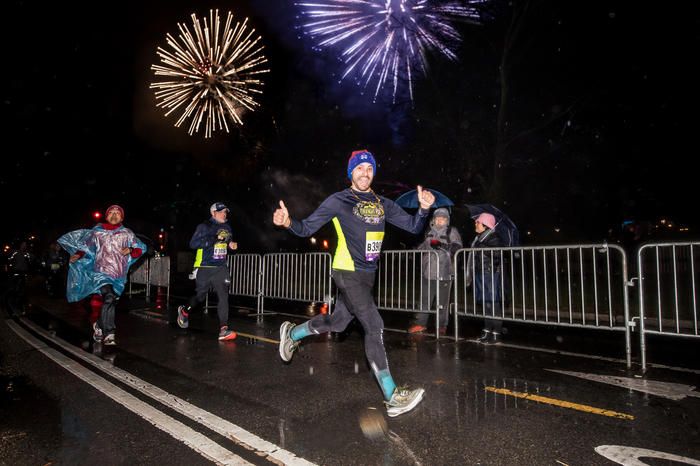 Runners racing in the Central Park Midnight Run on New Year's Eve events