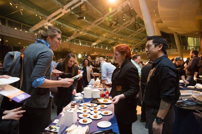 People at the Latke Festival tasting latkes