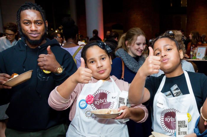 Kids give a thumbs up to their potato latkes