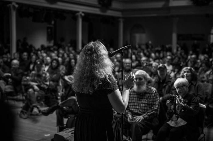 A performer in front of the crowd inside St. Marks church for the New Years Day poetry marathon