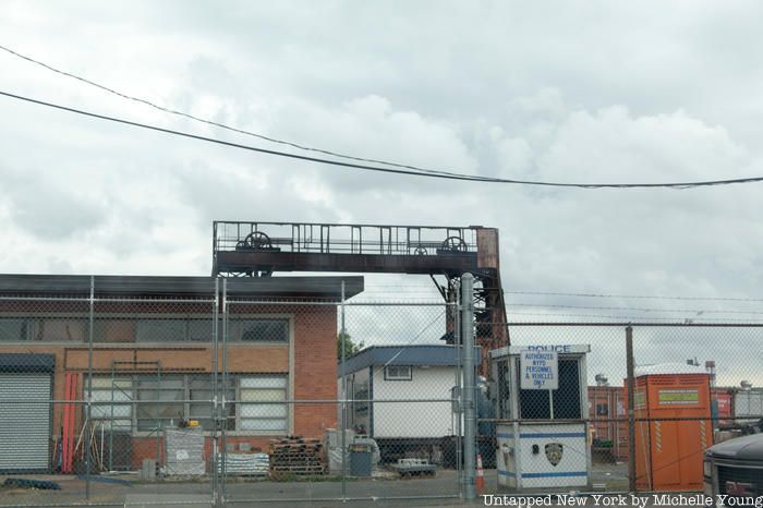 Port Morris gantries behind fence from NYPD lot