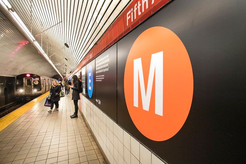 5th Av-53rd Street exhibit with MoMA and MTA on subway graphic design