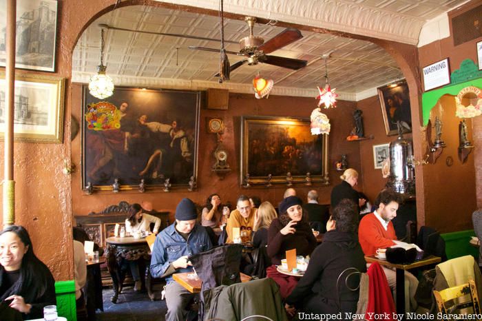 Inside of Caffe Reggio, a cozy coffee shop in Greenwich Village