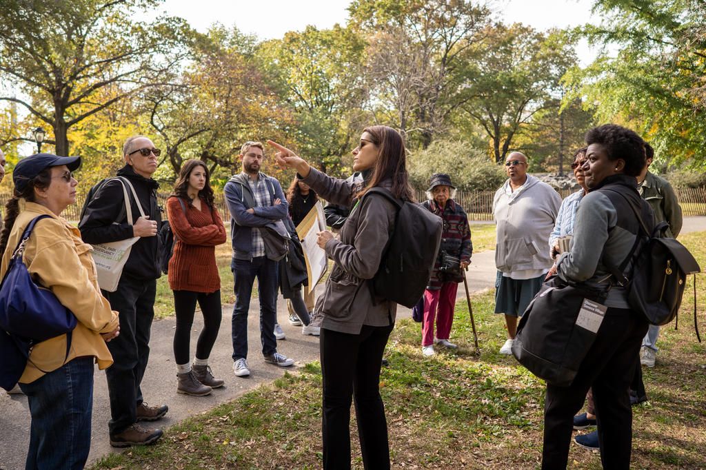 A tour group at the Seneca Village site in Central Park