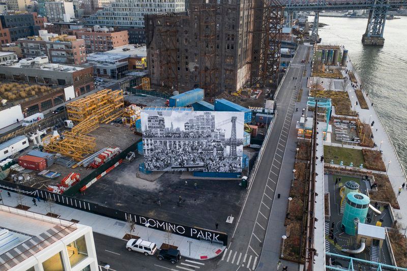 Aerial shot of JR's Chronicles of New york mural in Domino Park