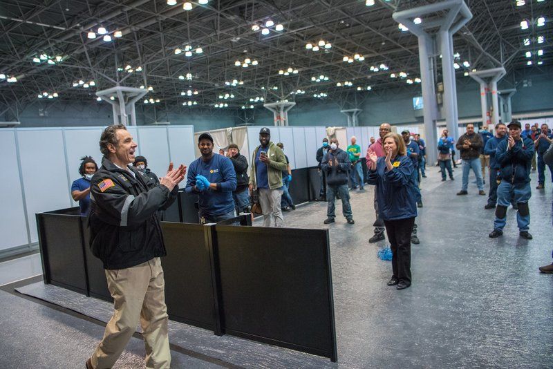 Cuomo applauding staff at Temporary hospital at Javits Center