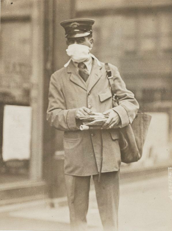 postal letter carrier wearing flu mask