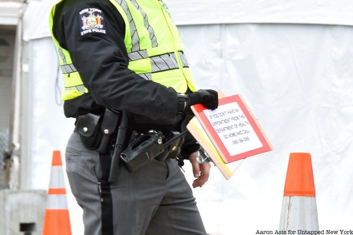 Sign held by State Trooper