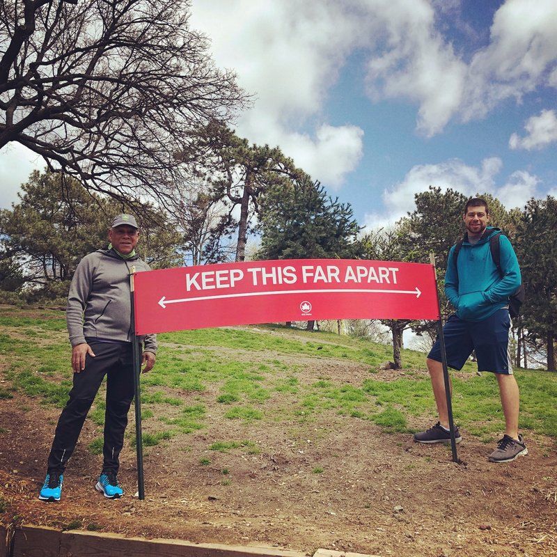 Mitchell Silver with Keep This Far Apart Social Distancing sign