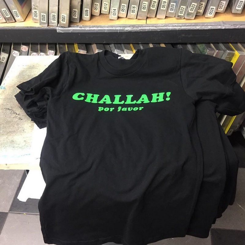 one of B&H's famous “CHALLAH! por favor” T-shirts, literally hot off the press at Works In Progress, the nonprofit that prints our shirts over on E. 4th Street. 