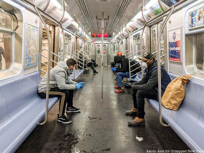 Passengers with gloves and masks on subway