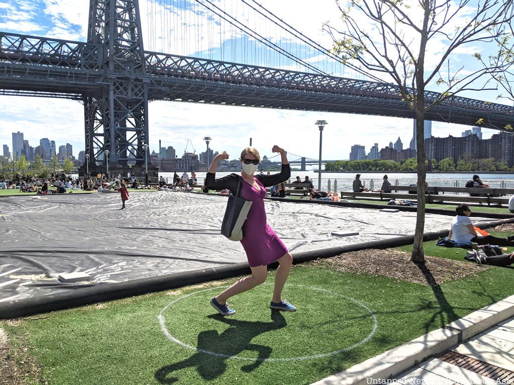 Woman posting at Social distancing circles at Domino Park