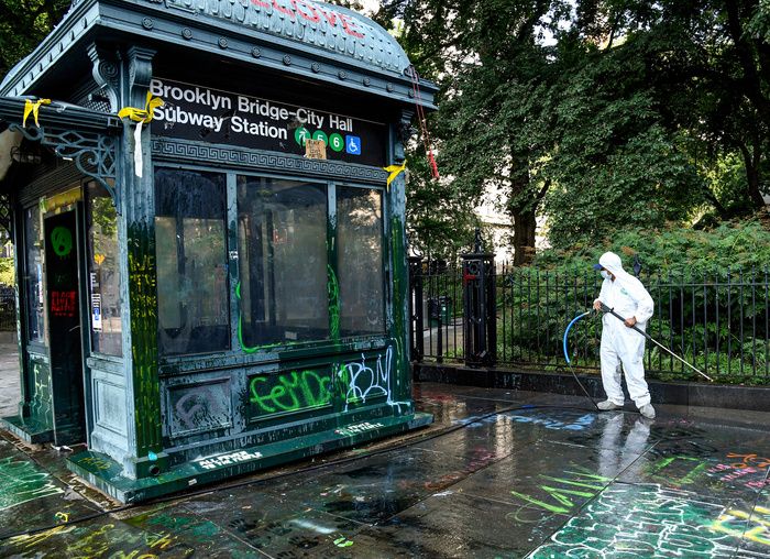 MTA workers cleanup the historic City Hall Subway Entrances