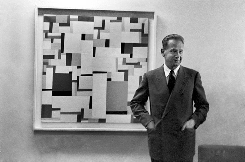 Mr. Dag Hammarskjöld, Secretary-General of the United Nations, photographed in his outer office, on the 38th floor of the Secretariat building, standing in front of "Rational Look," a geometrical abstract painting by Fritz Glarner, lent to the United Nations by New York's Museum of Modern Art. 01 March 1954